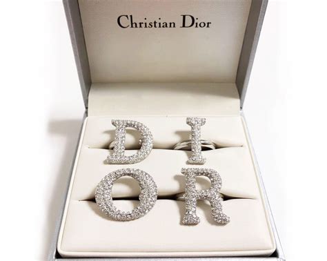 dior block letter ring.